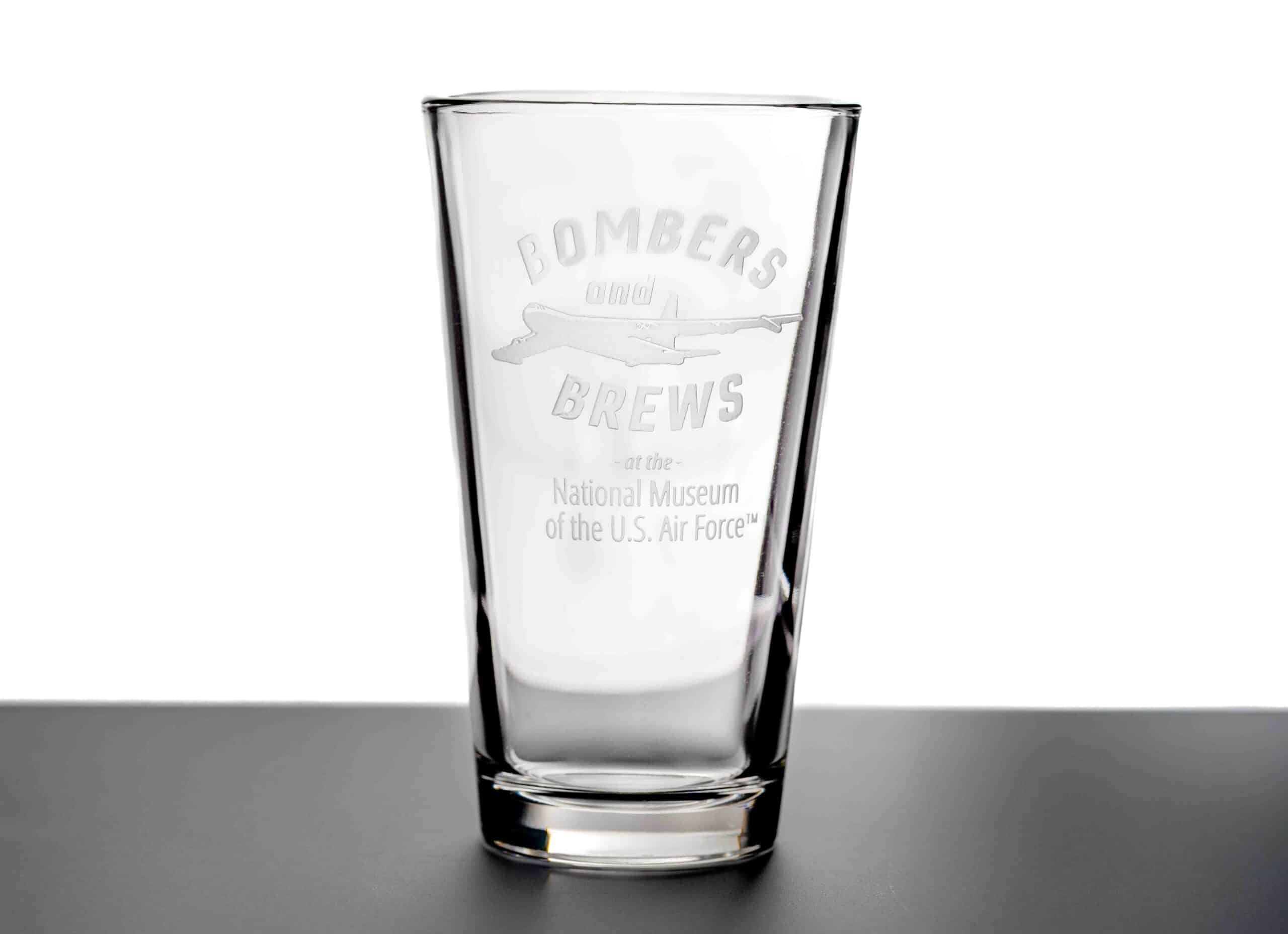 Clear pint glass etched with After Dark: Bombers and Brews logo